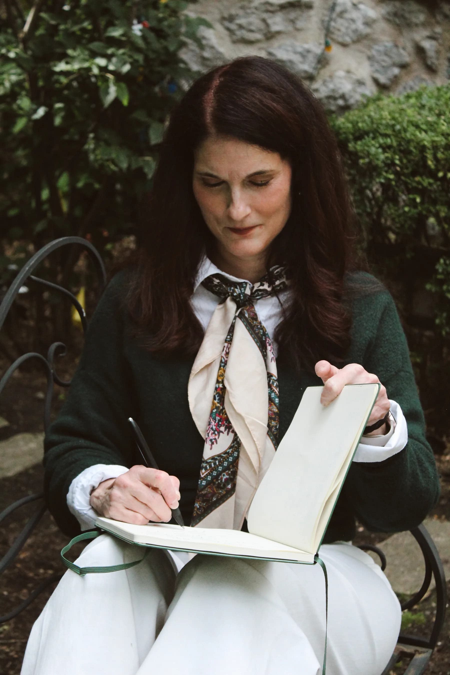 Abbie writing in a book